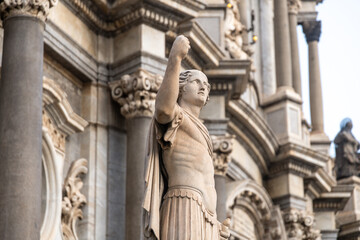 Stone statue on facade of SantAgata Cathedral