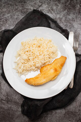 Sea fish fillet fried with boiled rice