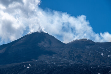 Smoking volcanic summit of Mount Etna in Sicily