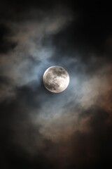 Full Moon Shining Through Dark Clouds at Night Dramatic Sky Atmospheric Scene Celestial Body Lunar Glow