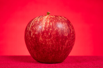 fresh apple on red background