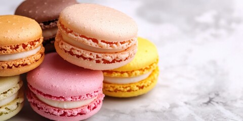 Fototapeta premium Colorful assorted macarons on marble surface sweet and delicious french dessert National Macaroon Day