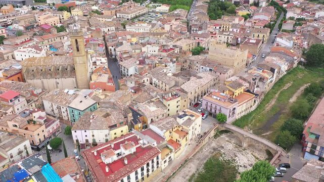 Summer view from drone of center of medieval Spanish town of La Bisbal d Emporda with episcopal palace castle and Church of Santa Maria, province of Girona, Catalonia
