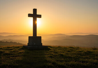 religious symbol silhouetted against dramatic sunrise over mountains
