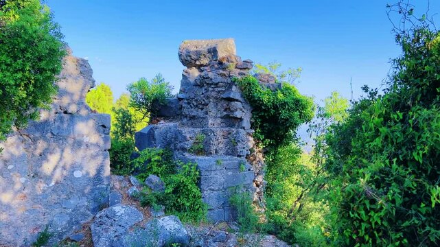 Ruins of the ancient Roman port city of Laertes in Alanya, Antalya, Turkey. Ruins of an ancient abandoned ancient city near Jebel Iresh mountain, Mediterranean coast. Mountainous Cilicia.4K