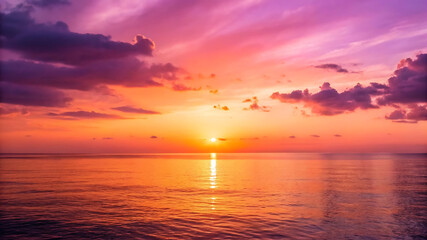 Obraz premium Vibrant Sunset over Calm Ocean A Stunning Display of Nature's Colors