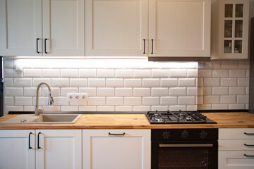 A beautiful kitchen detail with white cabinets