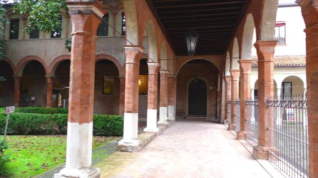 FERRARA, ITALY - NOVEMBER 25 2016: Ferrara, Italy: Square of Santa Anne. Portal with an adjoining cloister and portico remains today of ancient hospital.