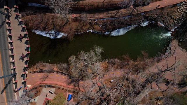 Downtown Golden Colorado aerial drone view Birdseye perspective Clear Creek River trail waterpark Golden Gate Canyon Grange bridge winter sunny snow fishing North Table Mountain Coors Factory upwards