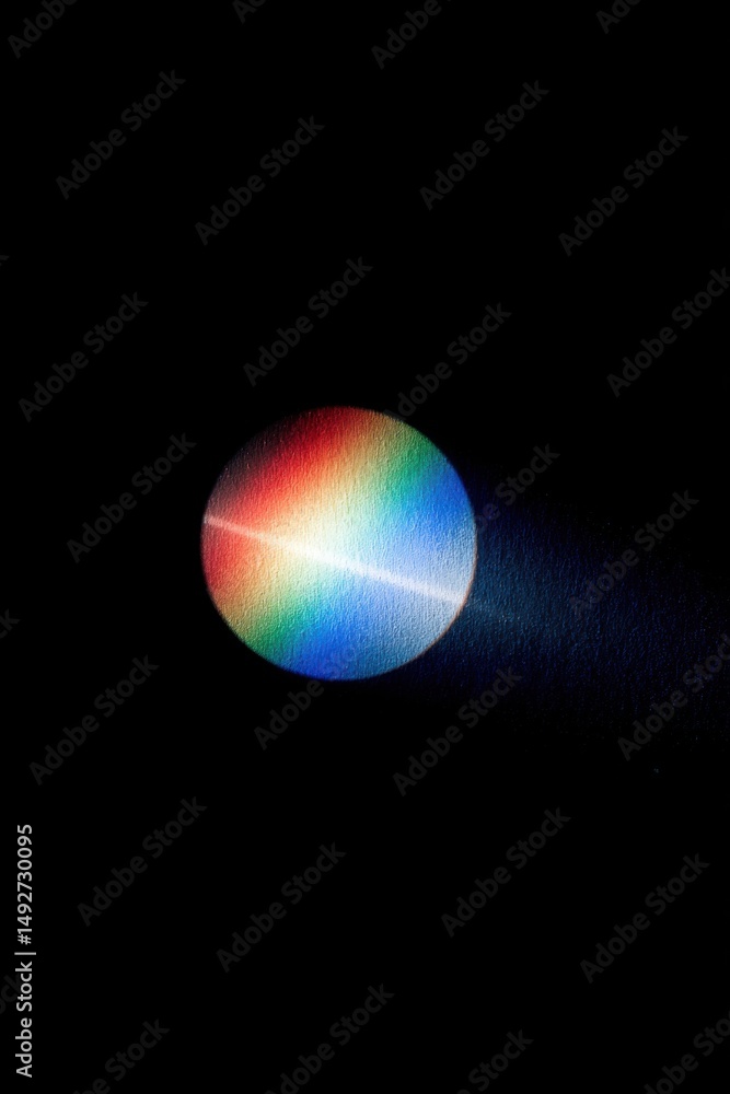 Poster rainbow spectrum on textured surface in dark room with light beam shining through prism for science 