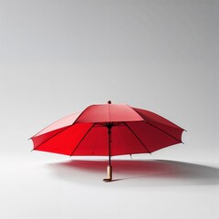 Fototapeta premium Bright red umbrella stands alone against a neutral background, showcasing its vibrant color and unique design in indoor light
