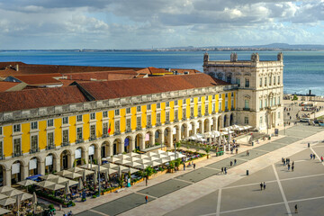 Commerce square, Lisbon, Portugal with yellow buildings and river