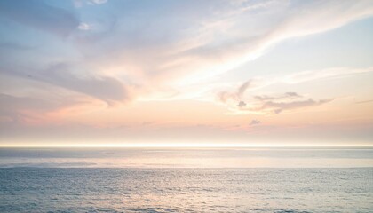Fototapeta premium Serene sunset over the tranquil ocean coastal view nature photography peaceful atmosphere