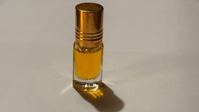 Golden liquid in a small glass bottle.