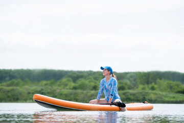 woman rowing sup board river water , paddleboard and surfing
