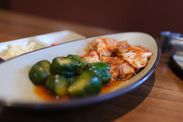 cabbage kimchi Pickled cucumber slices in mustard and coriander seeds.