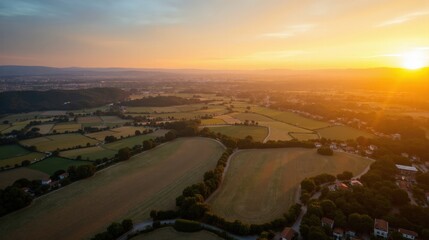 Aerial shot of Tablas de Daimiel in Spain at dawn, showcasing the sunlit landscape below.