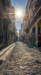 Fototapeta premium Sunlit Cobblestone Street in a Historic City