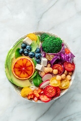 Buddha Bowl. Rainbow salad. Vegan poke bowl with avocado. Healthy food. Organic ingredients, top shot