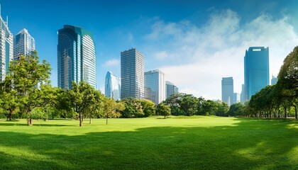 Fototapeta premium lush green lawn modern skyscrapers and lush trees in a city park