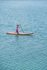Fototapeta premium woman rowing sup board river water , paddleboard and surfing