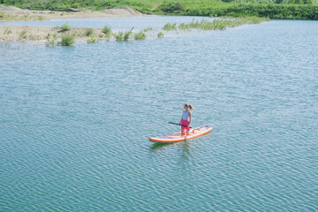 woman rowing sup board river water , paddleboard and surfing