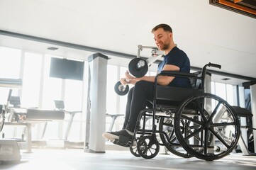 Patient lifting weights during rehabilitation in gym