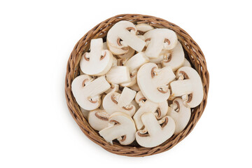 Fresh mushroom champignon slices in a wicker basket isolated on white background. Top view. Flat lay