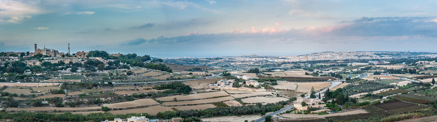 Fototapeta premium Panoramis view from the Mdina fortress of the rural area and fields Around. Panorama View. Malta.