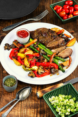 Roasted duck breast with vegetables.