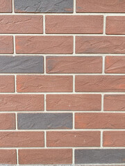 Decorative brick wall for exterior facade design, close-up textured surface background with realistic masonry details and structure