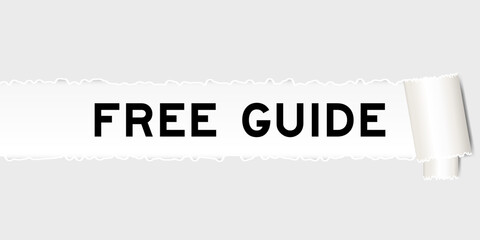 Ripped gray paper background that have word free guide under torn part