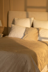 Cozy and Comfortable Bedroom with Soft Linens and Warm Lighting