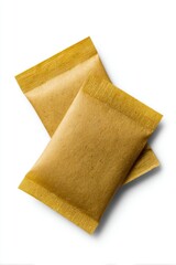 Two brown paper tea bags overlapping on white background studio shot top down view for tea time beverage concept