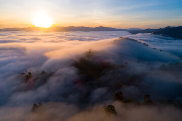 Fototapeta premium Drone aerial view of landscape fog over mountains in sunrise sky,High angle view over countryside at Southeast asia,Phang Nga Thailand,Wide angle view nature landscape