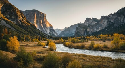 Fototapeta premium Stunning Autumnal Valley Landscape River Mountains and Golden Trees at Sunset