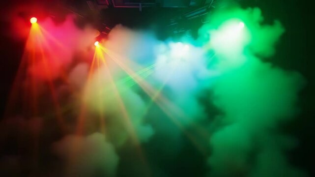 Colorful laser lights illuminating stage smoke during a concert  