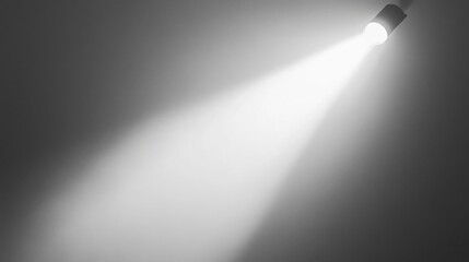 Naklejka premium a bright spotlight shines downward on a dark gray background