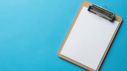 Blank clipboard with white paper on blue background.