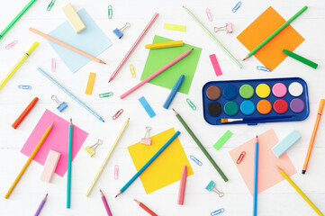 Back to school concept, school supplies and accessories on white background, water color, pencils, duster, crayons, flat lay copy space