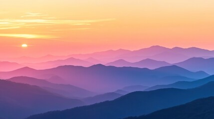 Obraz premium A sunset view from a mountain summit, with layers of peaks fading into the distance