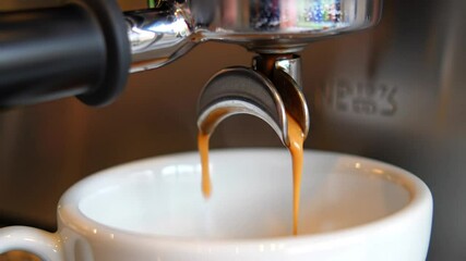 Espresso Machine Dispensing Coffee into White Cup Stream Rich Brown Color From Chrome Nozzle Perfect for illustrating Morning Routines Cafe Culture And Coffee Preparation Close Up Shot - Powered by Adobe