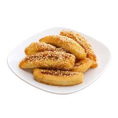 A close up shot of a white plate filled with fried pastries covered in sesame seeds on a white background on transparent background