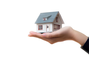 A miniature house held in a hand against a black background showcasing real estate concept clearly on transparent background