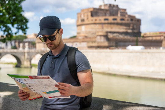 A young adventurous man, enjoying the beauties of Rome.