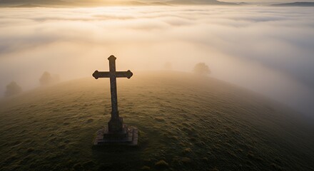 Stone Cross on Hill Surrounded by Fog