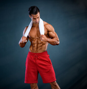 Handsome Muscular Shirtless Man Posing with Towel aroung his Neck