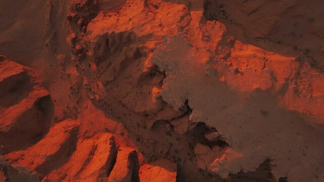 Aerial drone views of the Flaming Cliffs at sunset, exploring Mongolia&rsquo;s stunning red rock formations