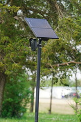 Flock safety police law enforcement license plate reader setup outside to help catch vehicle speeders.