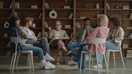 Group of Diverse Adults Talking in Circle During Therapy Session